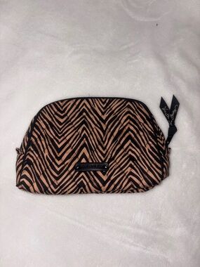 This is a Vera Bradley quilted cotton cosmetic bag in the "Zebra" pattern.